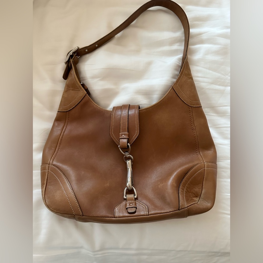 Used Coach handbag, small. Distressed look, tan leather.